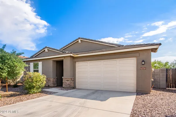 a front view of a house with a garage