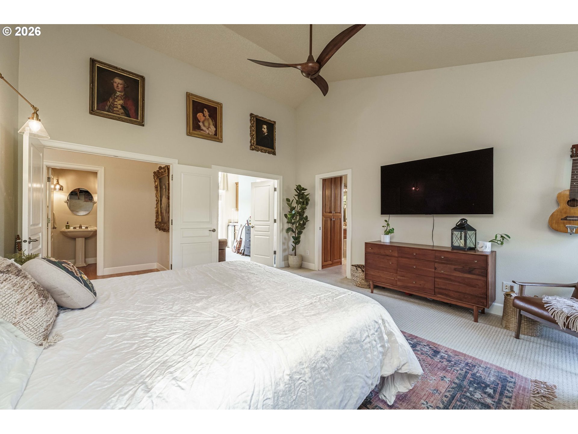 19121 Northwest 61st Avenue Ridgefield, WA 98642 - Photo 14 of 39 a bedroom with a bed and a flat screen tv