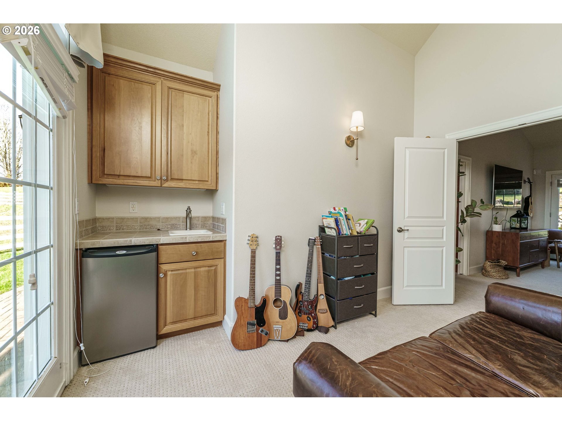 19121 Northwest 61st Avenue Ridgefield, WA 98642 - Photo 15 of 39 a kitchen with sink refrigerator and cabinets