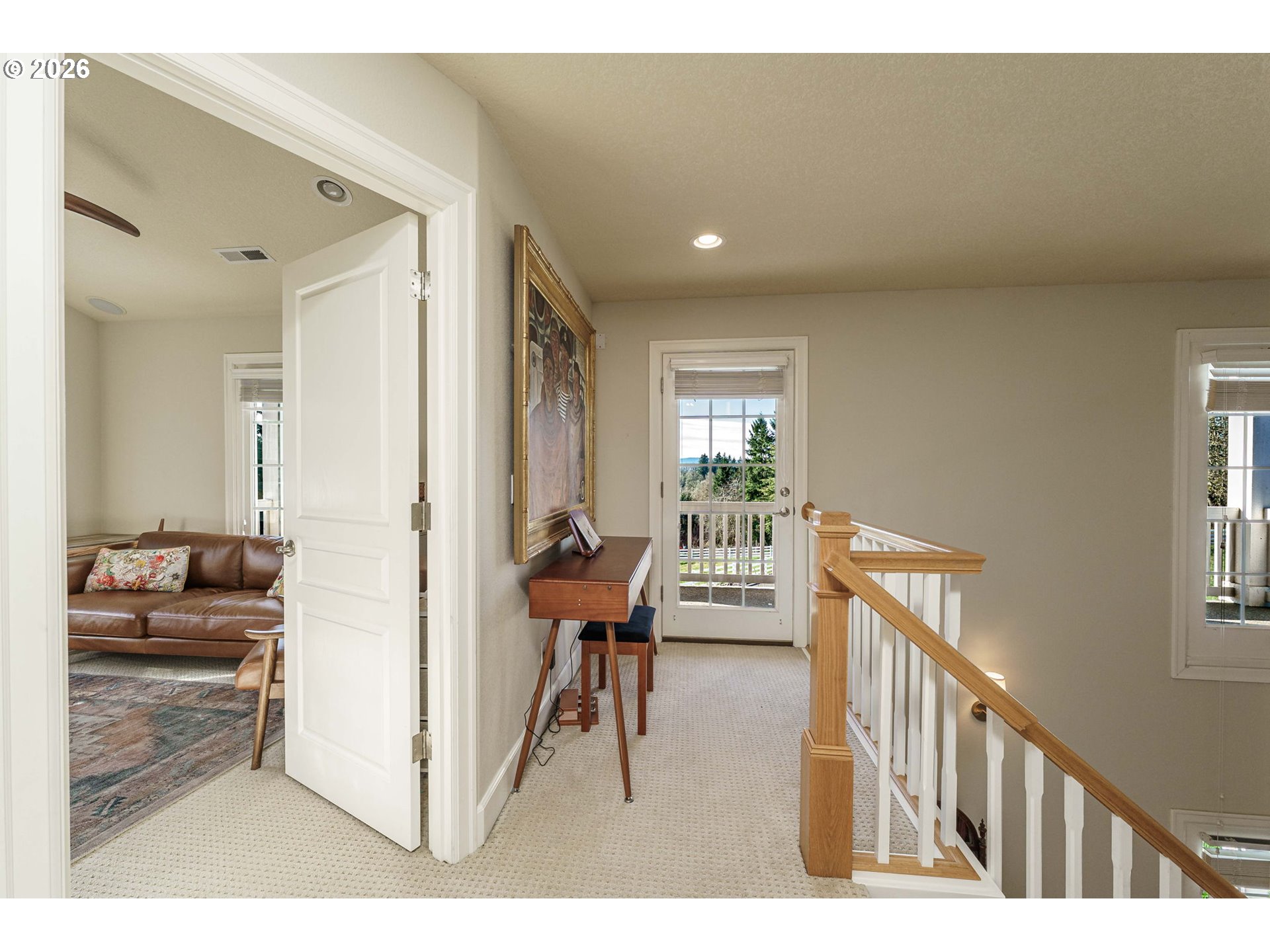 19121 Northwest 61st Avenue Ridgefield, WA 98642 - Photo 18 of 39 a view of a hallway with furniture and floor to ceiling window