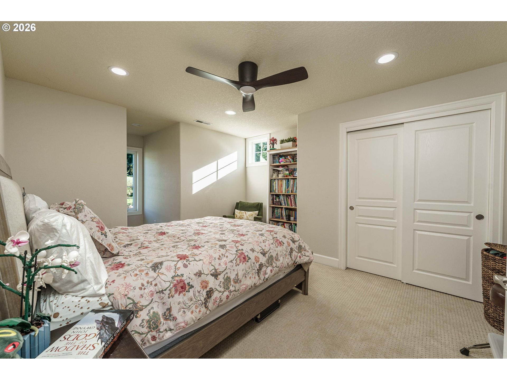 19121 Northwest 61st Avenue Ridgefield, WA 98642 - Photo 21 of 39 a bedroom with a bed and a cabinets