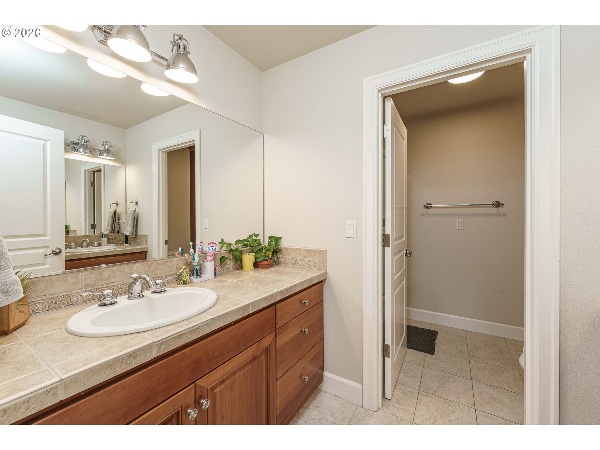 19121 Northwest 61st Avenue Ridgefield, WA 98642 - Photo 23 of 39 a bathroom with a sink double vanity and a mirror