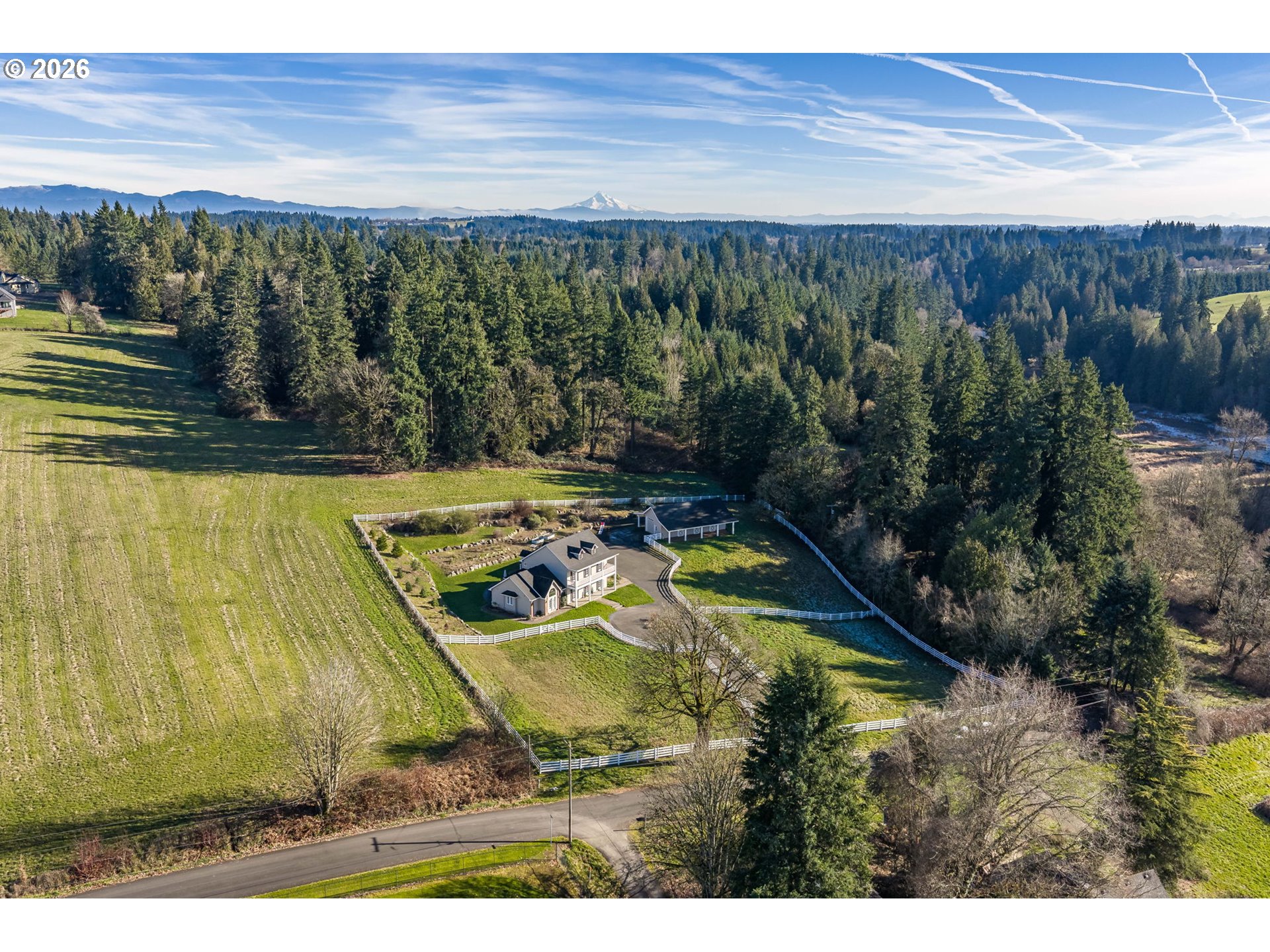 19121 Northwest 61st Avenue Ridgefield, WA 98642 - Photo 31 of 39 a view of a backyard with plants and lake view
