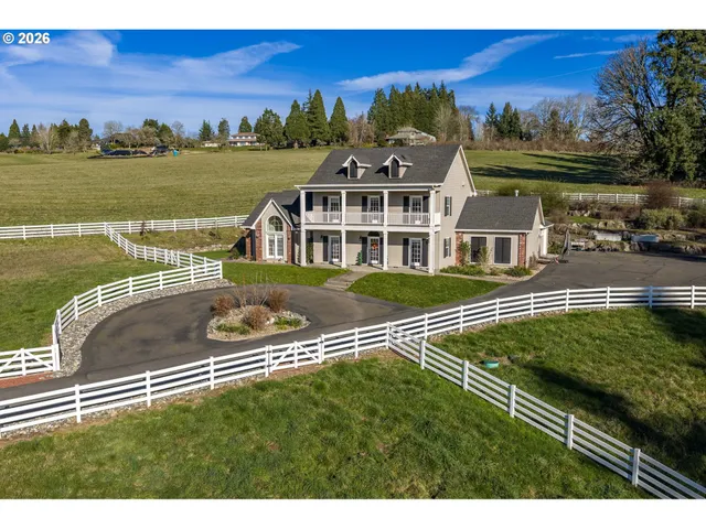 a view of a lake with a house in the background