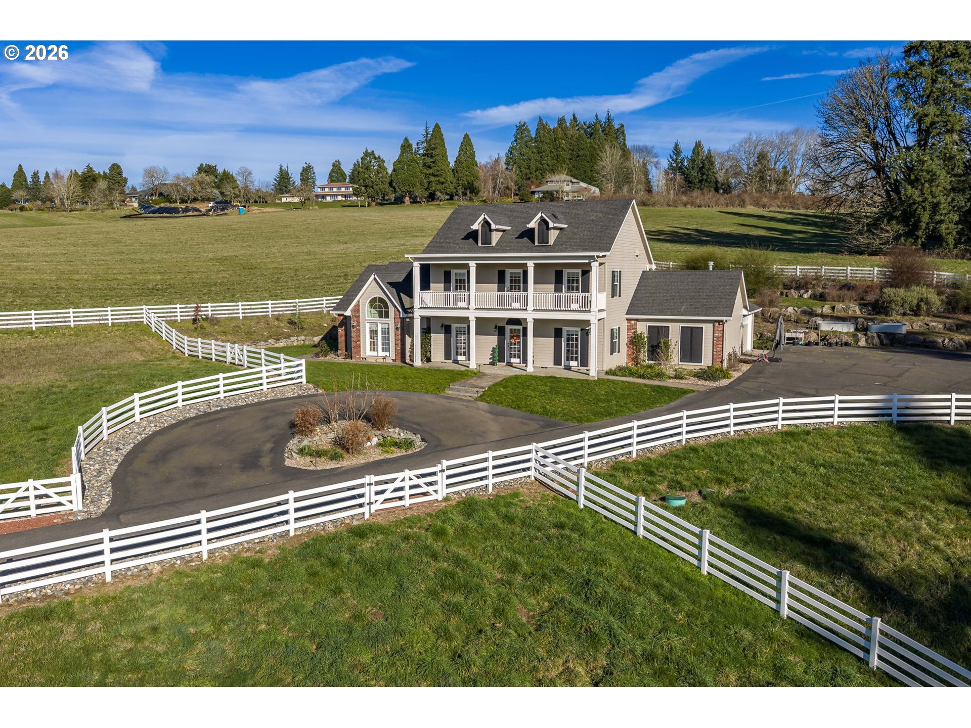 19121 Northwest 61st Avenue Ridgefield, WA 98642 - Photo 35 of 39 a view of a lake with a house in the background
