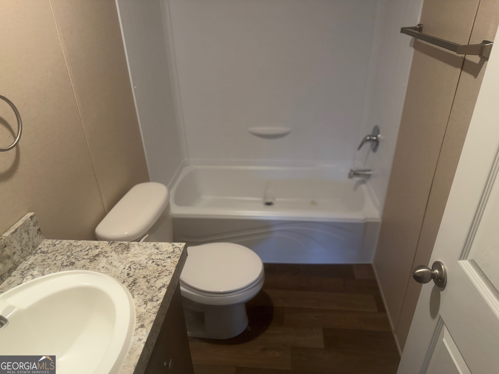 832 Stone Stewart Road Hull, GA 30646 - Photo 11 of 15 a bathroom with a granite countertop toilet sink and mirror