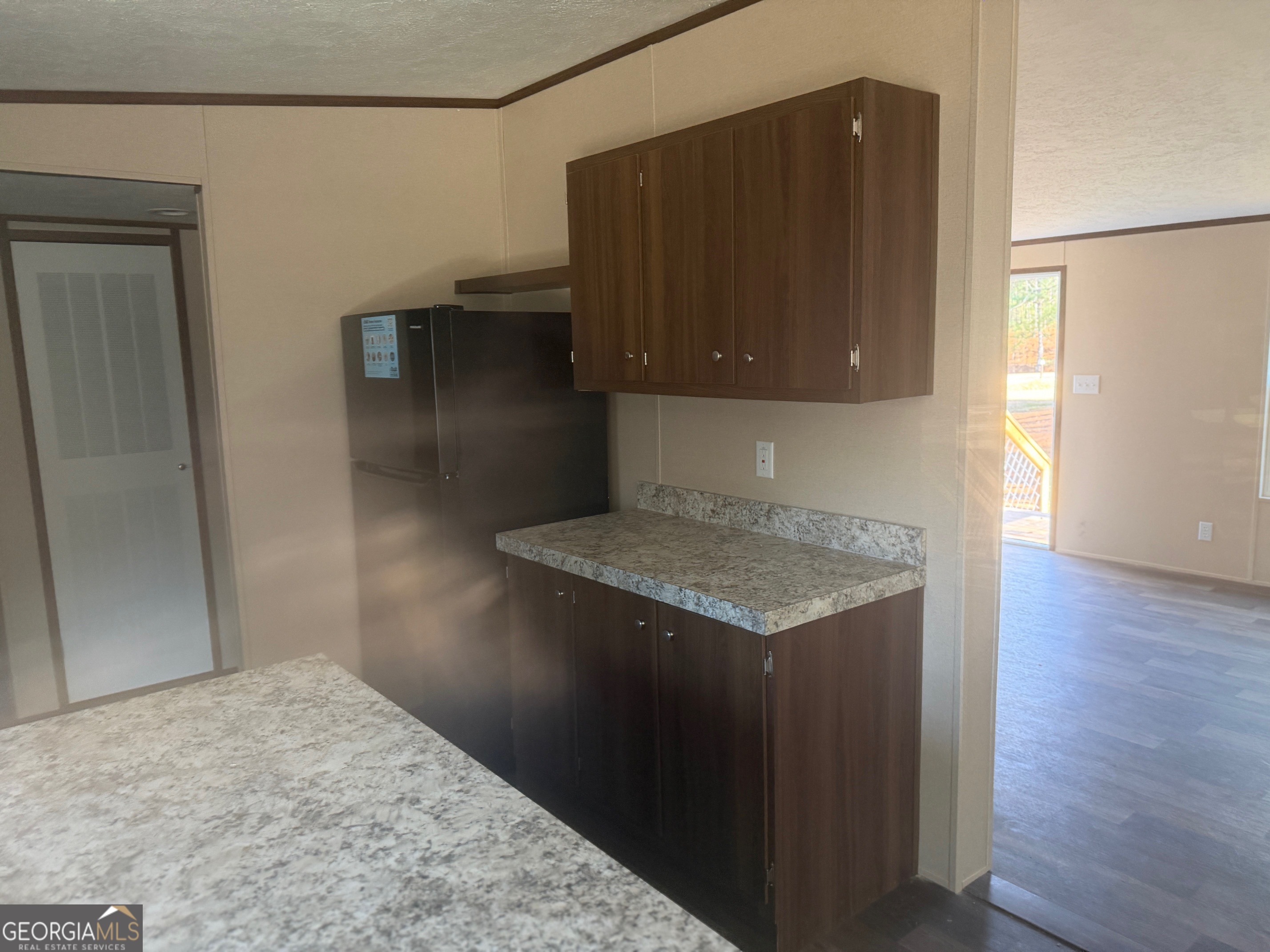 832 Stone Stewart Road Hull, GA 30646 - Photo 8 of 15 a kitchen with a sink and a refrigerator
