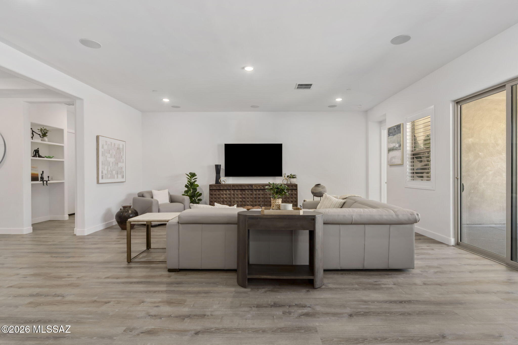 12791 East Tortoise Pointe Drive Vail, AZ 85641 - Photo 10 of 50 a living room with furniture and a flat screen tv