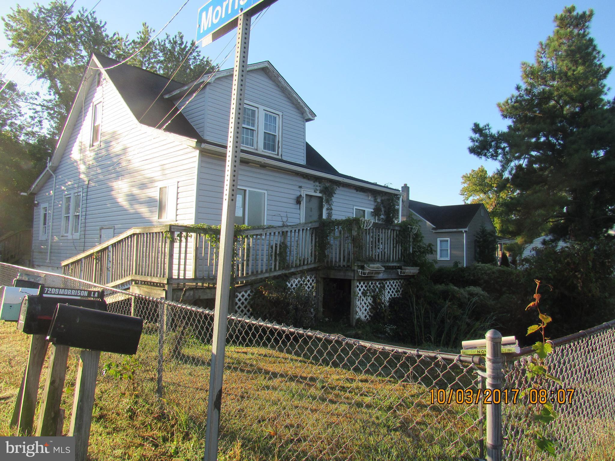2907 Sparrows Point Road Baltimore, MD 21219 - Photo 1 of 24 a view of a house with a yard