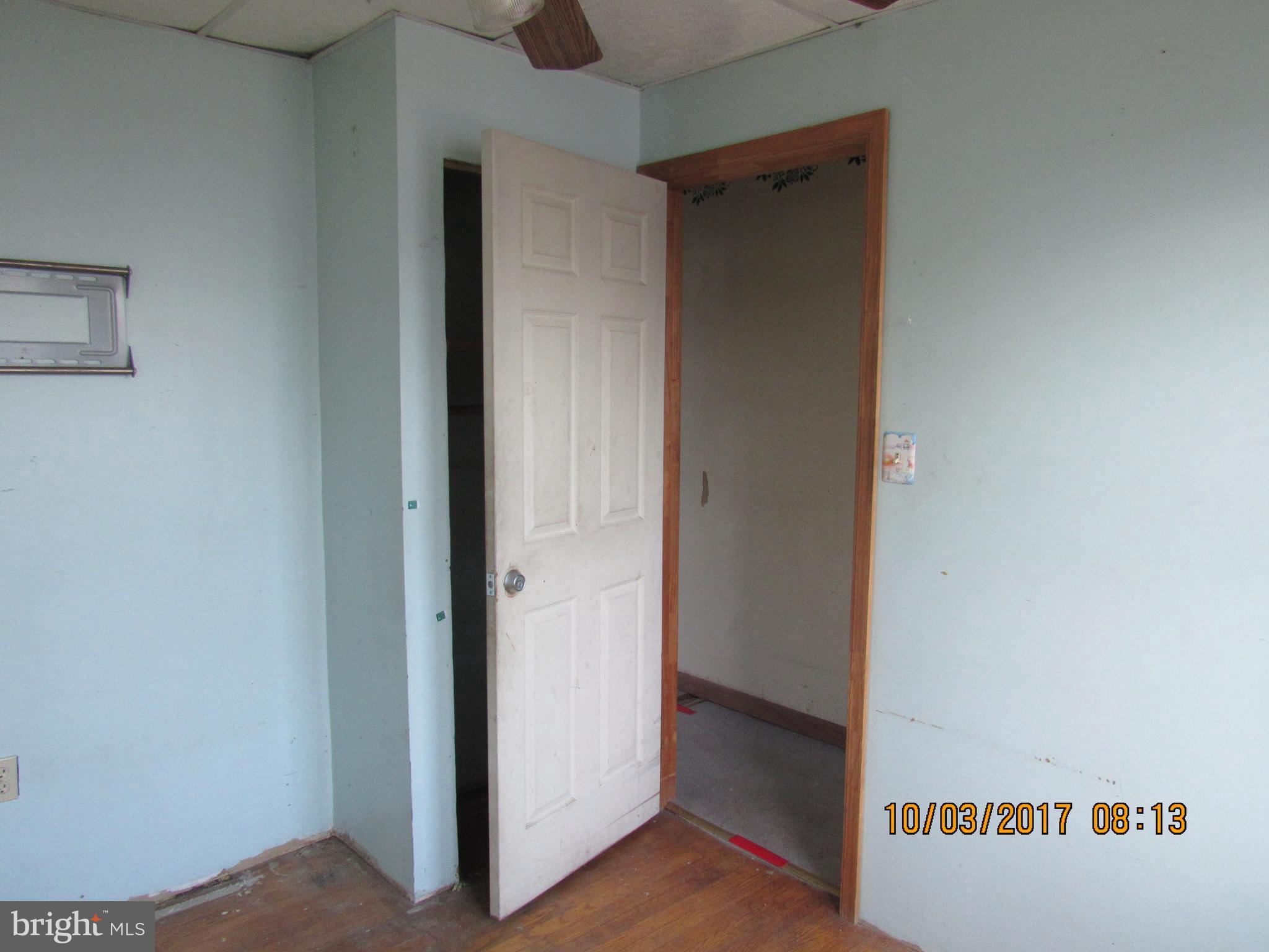 2907 Sparrows Point Road Baltimore, MD 21219 - Photo 13 of 24 a view of a hallway with wooden floor