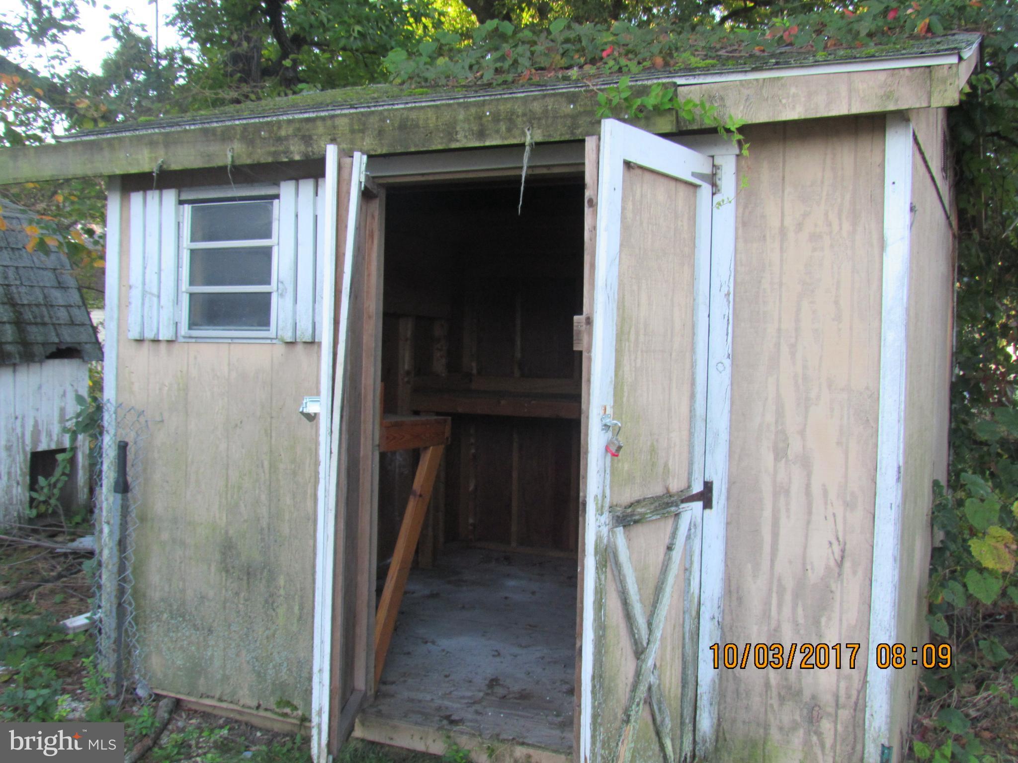 2907 Sparrows Point Road Baltimore, MD 21219 - Photo 4 of 24 a view of a house with a wooden door