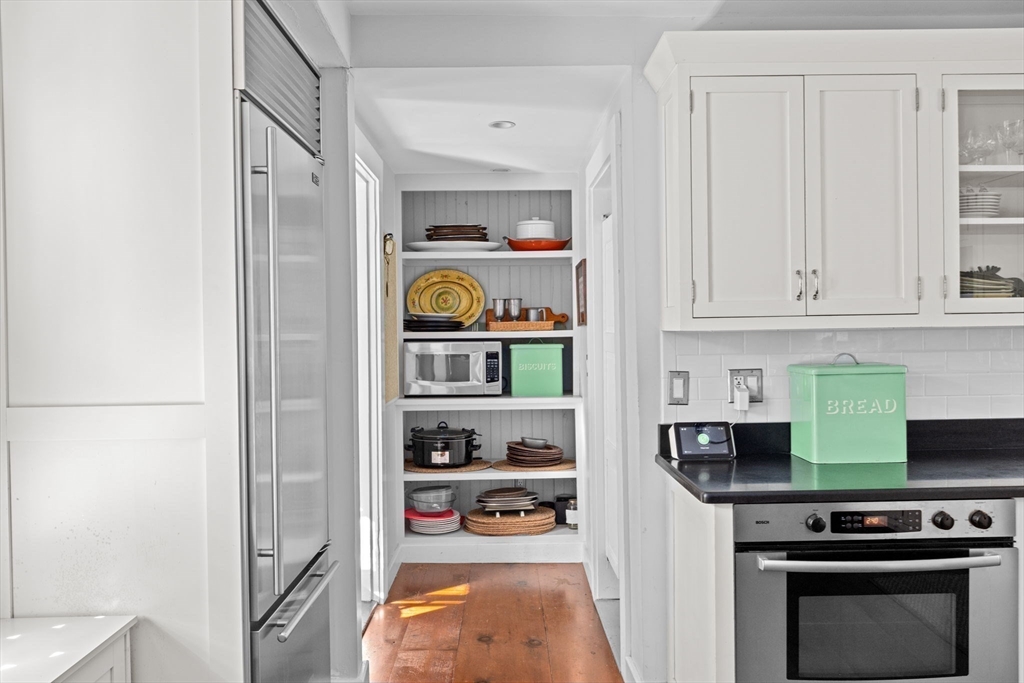 74 Tilden Road Scituate, MA 02066 - Photo 11 of 42 a kitchen with stainless steel appliances a refrigerator and a stove