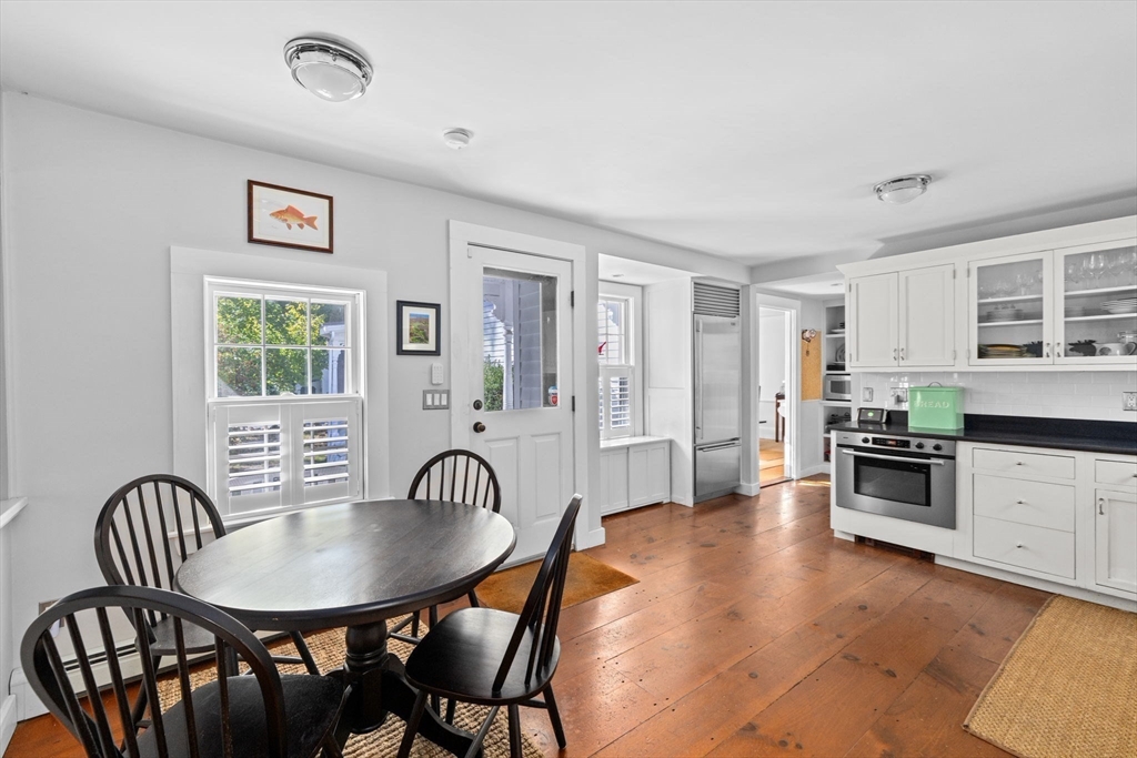 74 Tilden Road Scituate, MA 02066 - Photo 13 of 42 a view of a dining room with furniture window and wooden floor