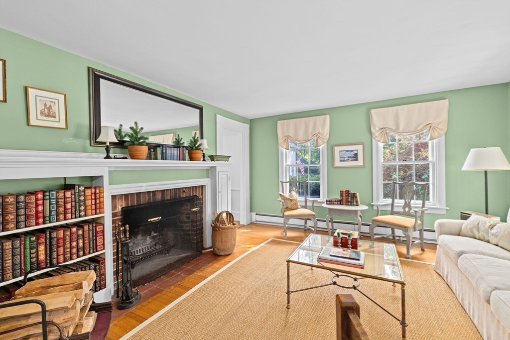 74 Tilden Road Scituate, MA 02066 - Photo 25 of 42 a living room with furniture a window and a fireplace