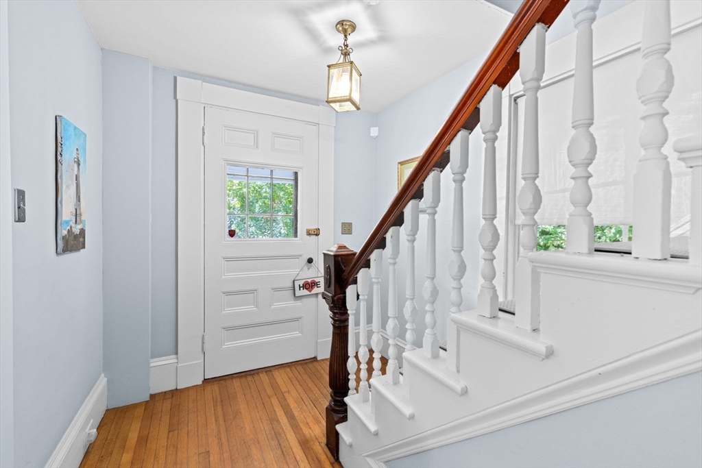74 Tilden Road Scituate, MA 02066 - Photo 28 of 42 a view of entryway with wooden floor and stairs