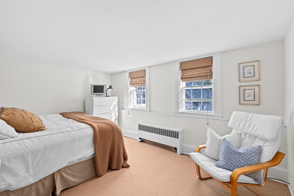 74 Tilden Road Scituate, MA 02066 - Photo 31 of 42 a bedroom with a bed and a couch