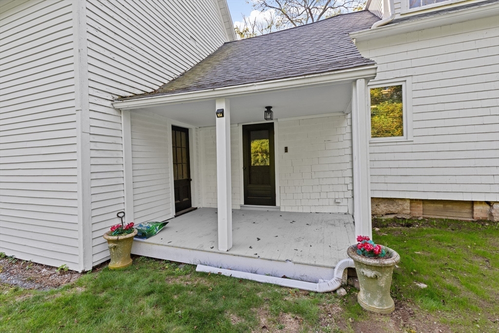 74 Tilden Road Scituate, MA 02066 - Photo 36 of 42 a front view of a house with garden
