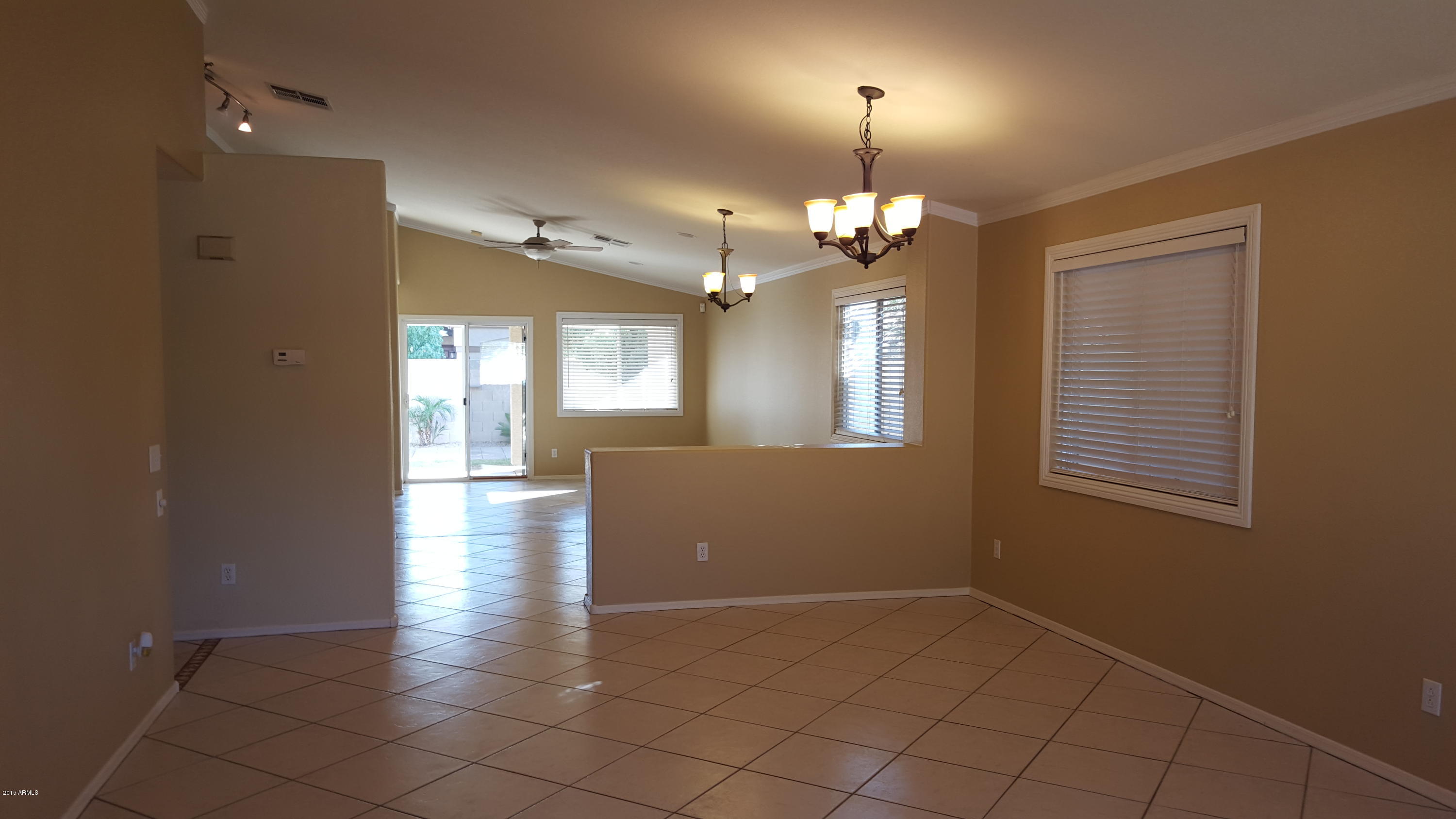 10465 West Granada Road Avondale, AZ 85392 - Photo 3 of 24 Living rm and family rm