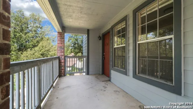 a view of a house with pool and sitting area