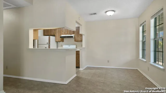 a view of kitchen and wooden floor
