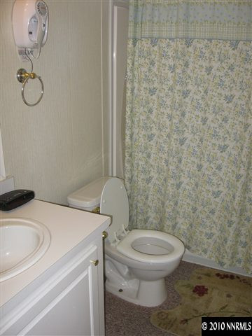 2159 Barberry Way Reno, NV 89512 - Photo 7 of 7 a bathroom with a toilet and a sink