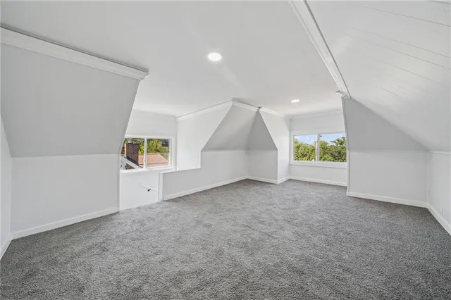 an empty room with windows and entrance