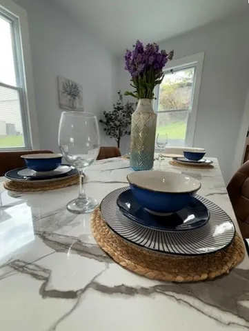 a table with a vase and flowers