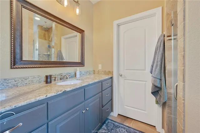 a bathroom with 2 sink and a mirror