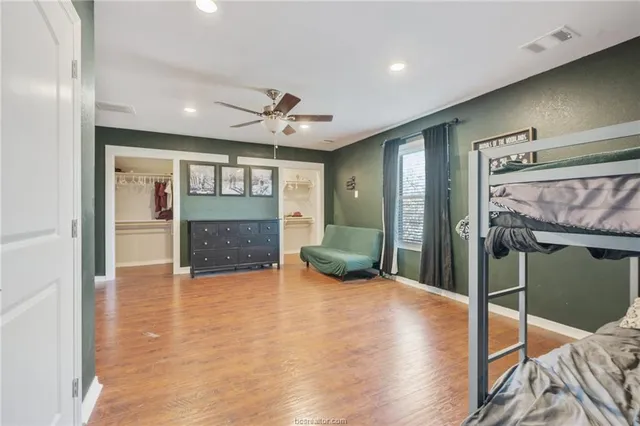 a view of livingroom with hardwood floor and a ceiling fan