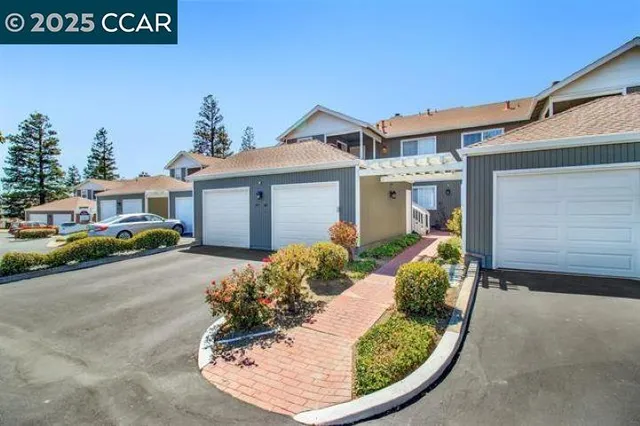 front view of a house with a small yard