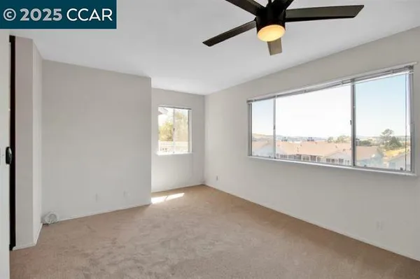 a view of an empty room with a window