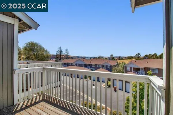a view of a balcony with city view