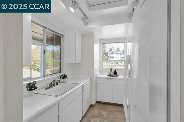 a room with a sink and a window