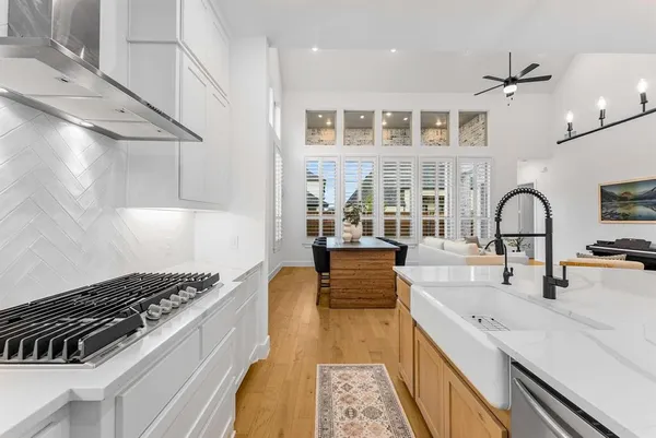a kitchen with a stove and a sink