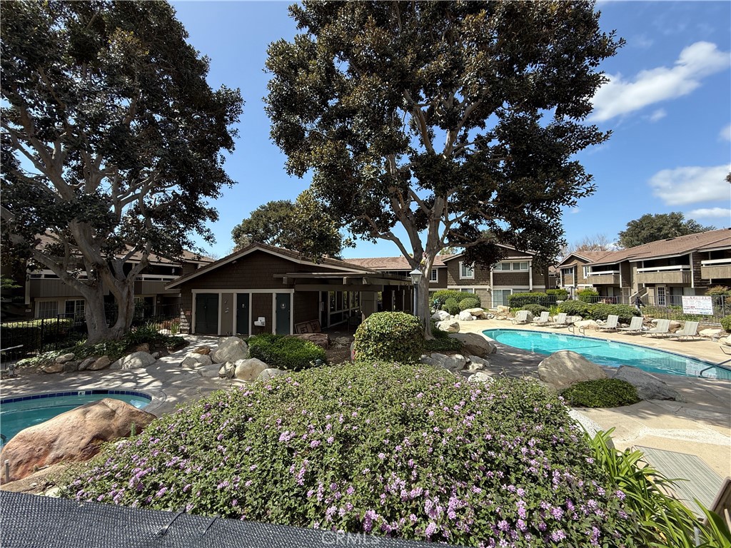 229 Springview Irvine, CA 92620 - Photo 15 of 16 a front view of a house with a yard and outdoor seating