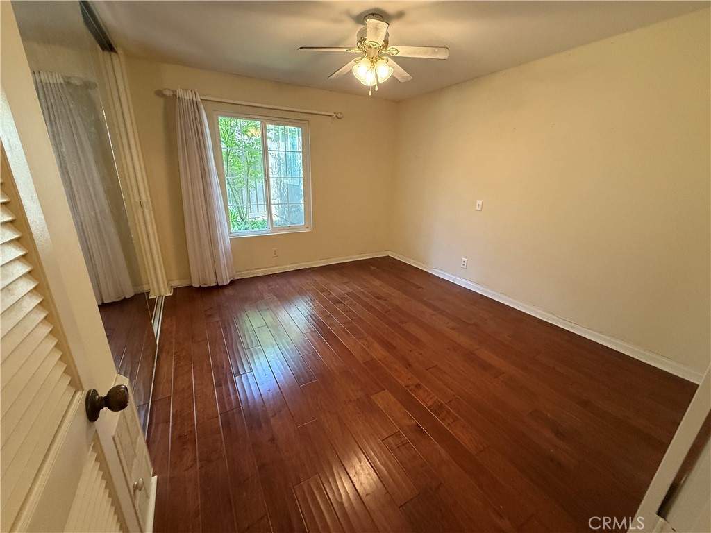 229 Springview Irvine, CA 92620 - Photo 4 of 16 wooden floor in an empty room with a window