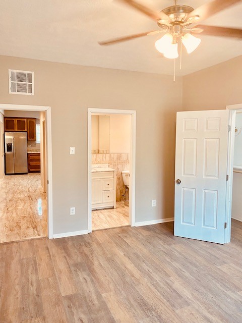 1602 Henninger Street Houston, TX 77023 - Photo 12 of 20 a view of a room with wooden floor and ceiling fan