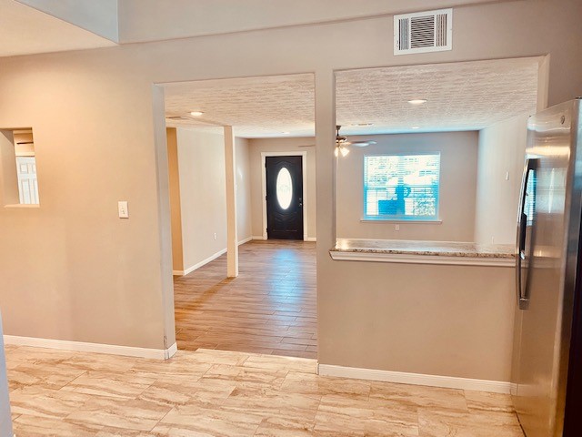 1602 Henninger Street Houston, TX 77023 - Photo 3 of 20 a view of a hallway with wooden floor and a bathroom