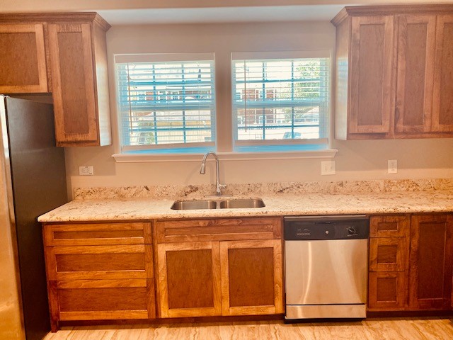 1602 Henninger Street Houston, TX 77023 - Photo 6 of 20 a kitchen with granite countertop cabinets and window