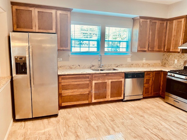 1602 Henninger Street Houston, TX 77023 - Photo 7 of 20 a kitchen with stainless steel appliances granite countertop a refrigerator and a sink