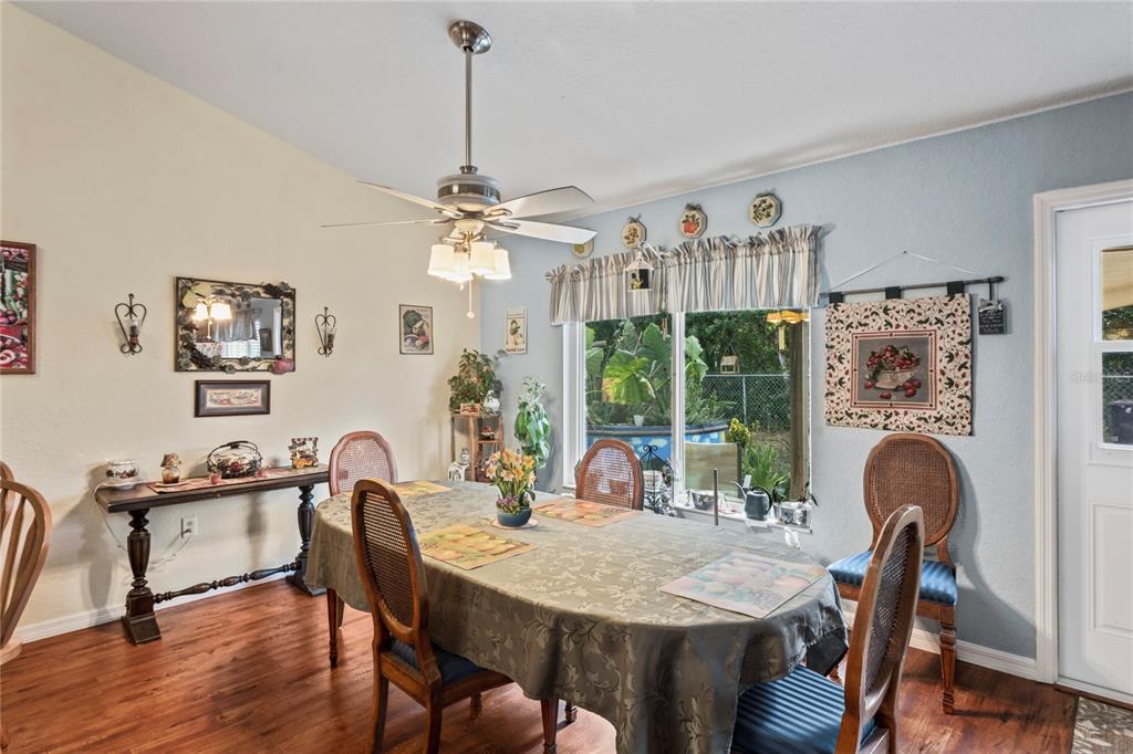 9086 Manchester Street Spring Hill, FL 34606 - Photo 17 of 50 a view of a dining room with furniture window and outside view