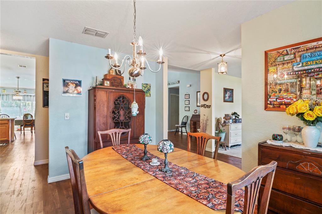 9086 Manchester Street Spring Hill, FL 34606 - Photo 22 of 50 a view of a dining room with furniture