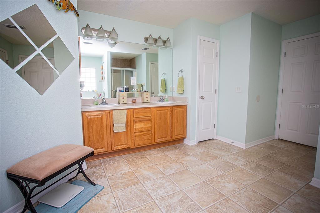 9086 Manchester Street Spring Hill, FL 34606 - Photo 27 of 50 a view of a livingroom with furniture and kitchen view