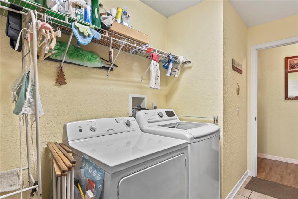 9086 Manchester Street Spring Hill, FL 34606 - Photo 33 of 50 a utility room with dryer and washer