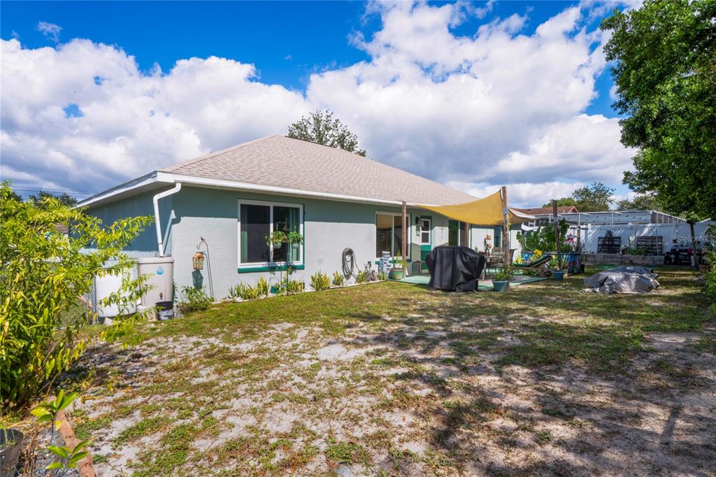 9086 Manchester Street Spring Hill, FL 34606 - Photo 37 of 50 a view of a house with a yard