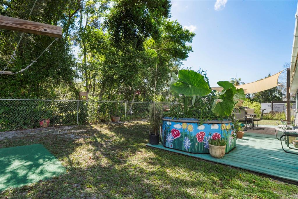 9086 Manchester Street Spring Hill, FL 34606 - Photo 39 of 50 a view of outdoor space with garden and entertaining space
