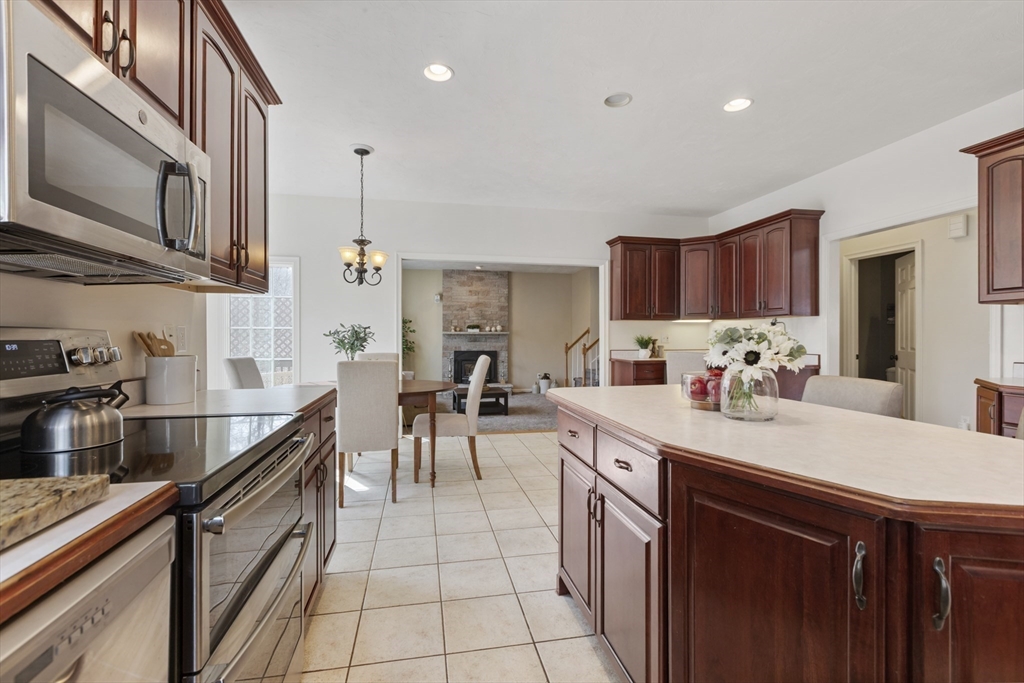 10 Anna Way Norton, MA 02766 - Photo 12 of 40 a kitchen with stainless steel appliances a sink dishwasher stove refrigerator and cabinets