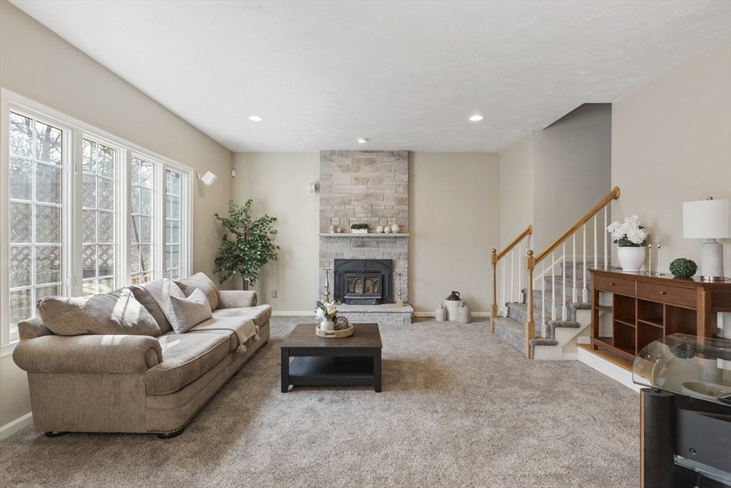 10 Anna Way Norton, MA 02766 - Photo 15 of 40 a living room with furniture and a fireplace