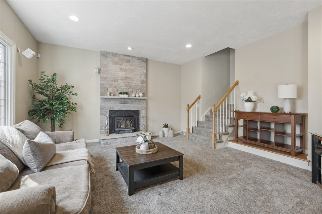 10 Anna Way Norton, MA 02766 - Photo 16 of 40 a living room with furniture and a fireplace
