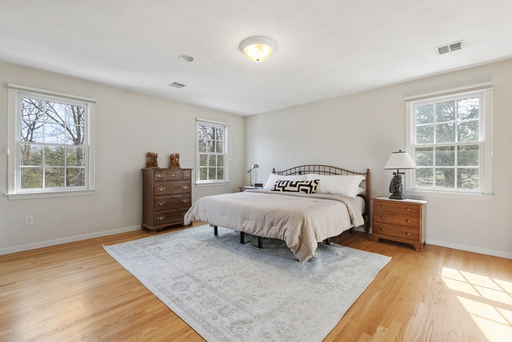 10 Anna Way Norton, MA 02766 - Photo 21 of 40 a spacious bedroom with a bed and a window